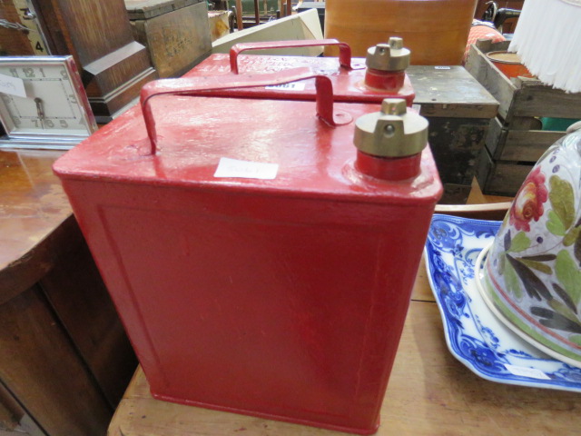 Two vintage red painted fuel cans