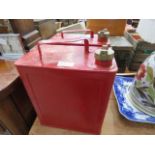 Two vintage red painted fuel cans