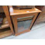 A dark wood stereo cabinet with JVC turntable and mini hi-fi under