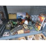 A cage of assorted items, to include: collectable military figurines, daggers, lighters and belt