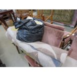 2 rolls of grey and cream carpet and a bag of floral decorated cushion covers