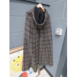 Black and white knitted cape