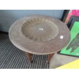 Brass topped circular oriental table with bobbin turned legs