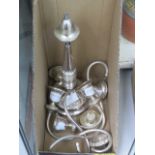 A white metalware candlestick