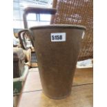 A small flower vase in the form of a vintage rusty bucket