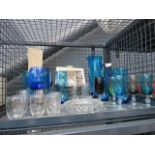 A cage of blue glassware, wine glasses, cut glass trinket bowls and Ravenshead Olympic drinking