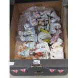 Box of ceramic figurines to include children, owls, Oriental lady, miniature boots