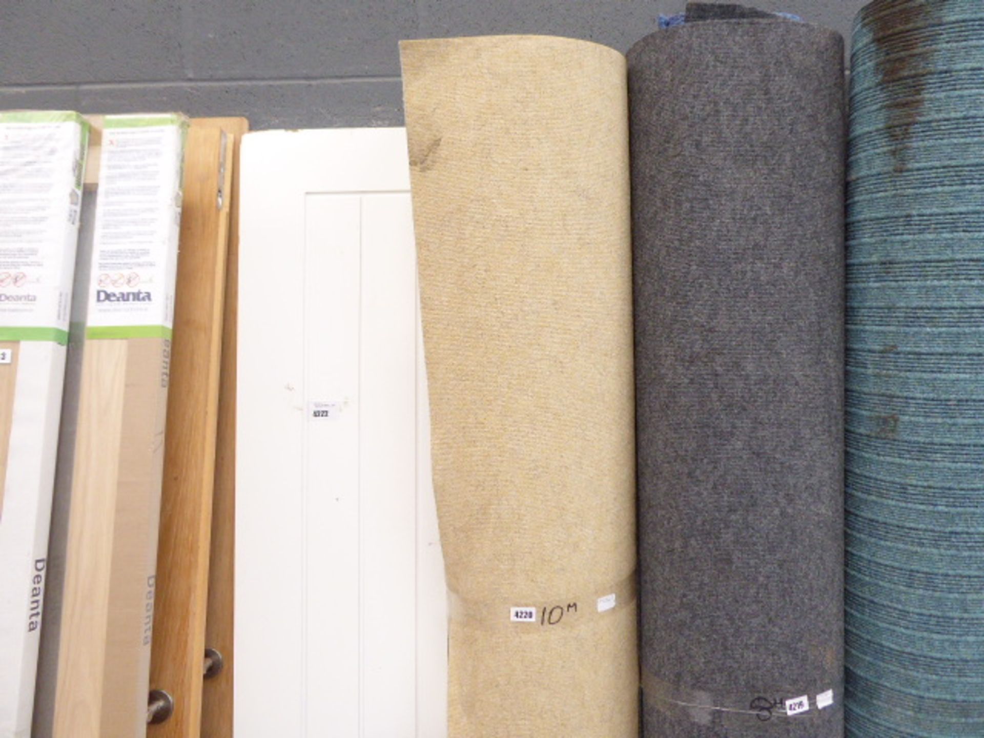 14) 10m roll of commercial carpet in beige