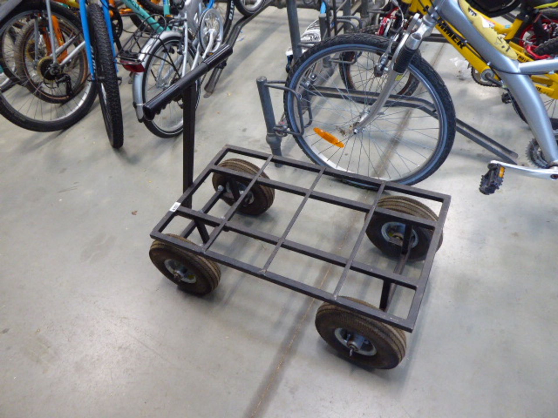Metal framed four wheeled trolley