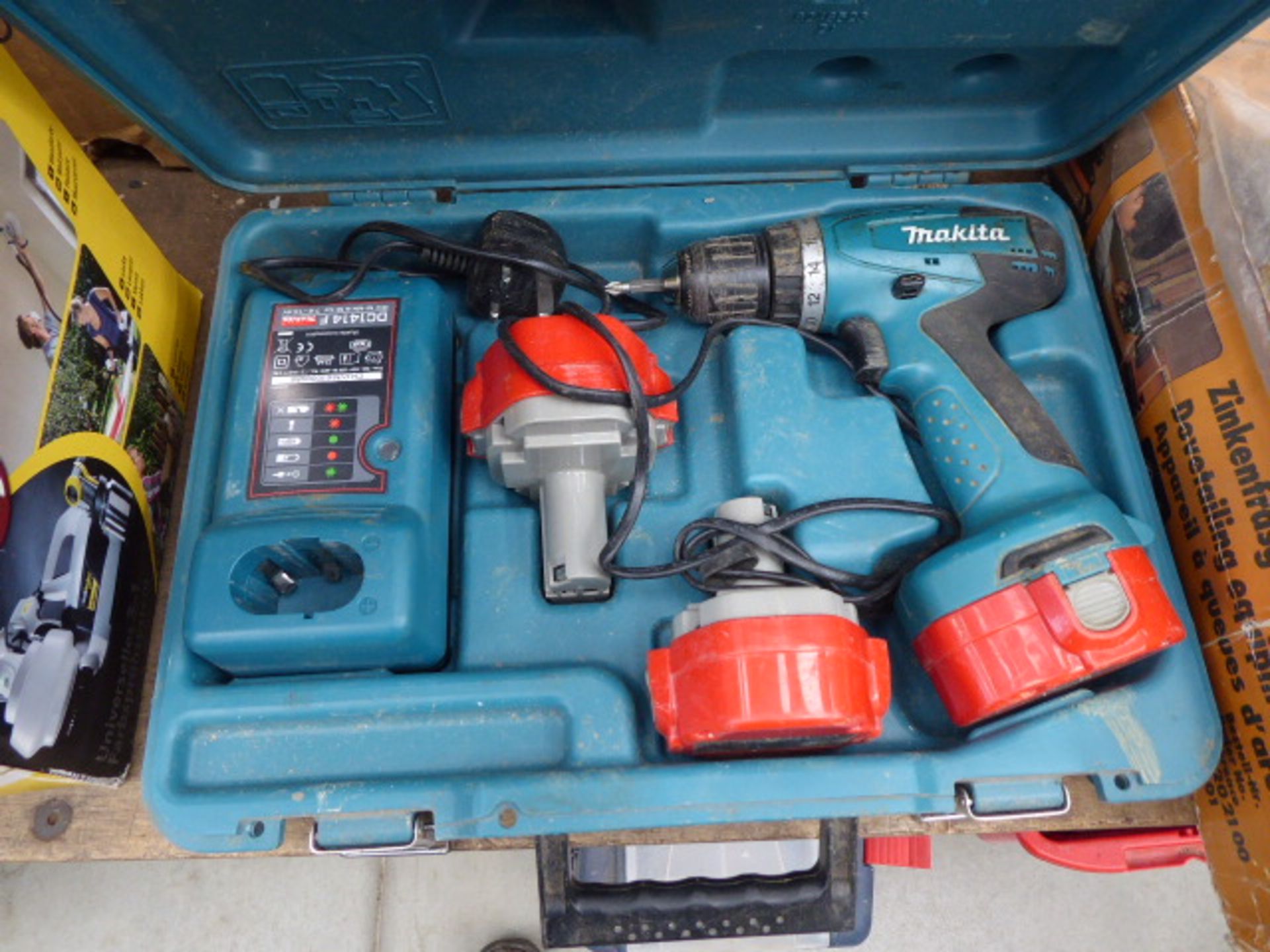 Makita cordless drill with three batteries and a charger
