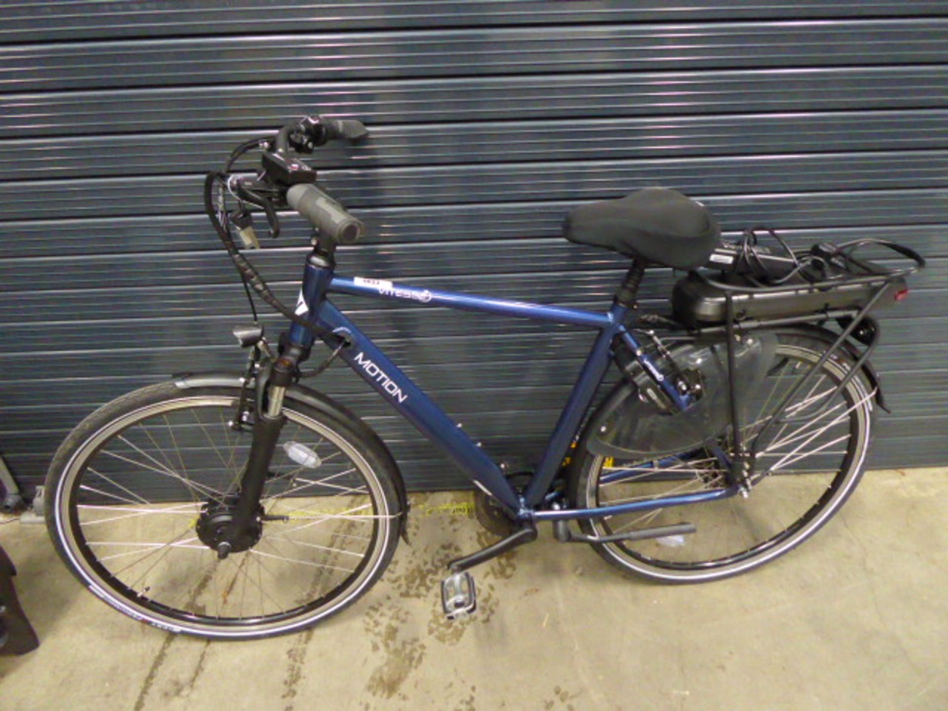 Vitesse Motion electric bike in blue with battery and charger