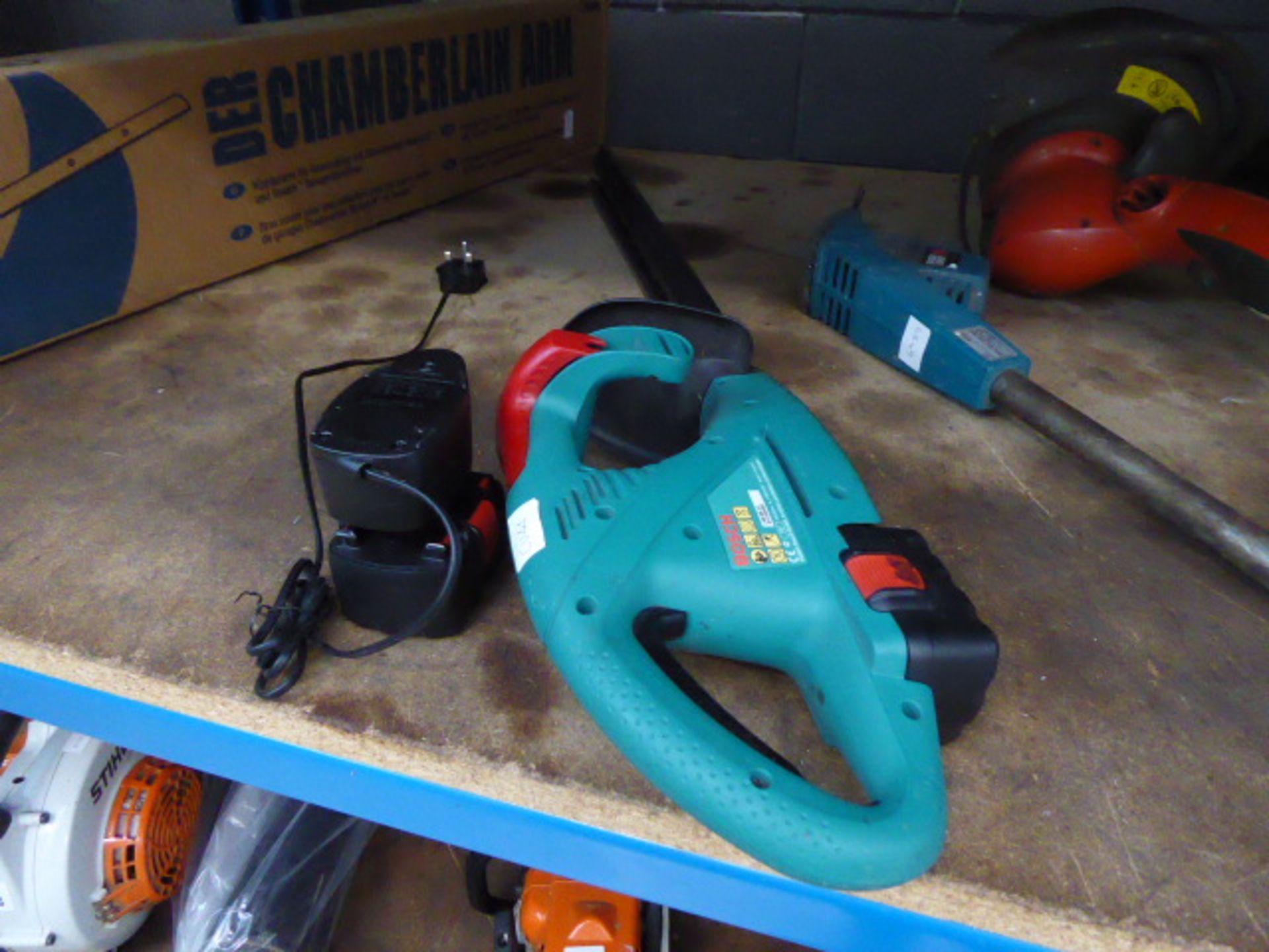 Bosch cordless hedge trimmer with tow batteries and a charger