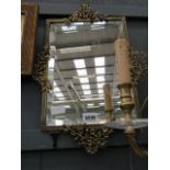 Rectangular bevelled mirror in decorative brass frame