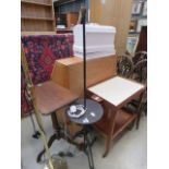 5383 - A wrought iron standard lamp with shelf