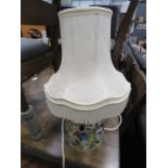 5062 - A floral decorated pottery table lamp with shade