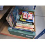 Box containing board games, vinyl records and childrens annuals