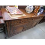Oak sideboard with carved panels