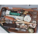 A box containing inkwells, snuff boxes, loose cutlery, glassware and ornaments