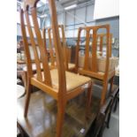 Four teak 1960's dining chairs collector's items (see soft furnishings policy) https://www.