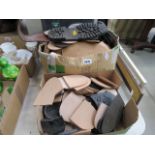 Two boxes containing leather and other shoe heels