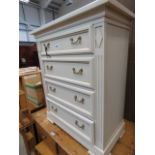 A cream painted French style chest of four drawers