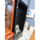 A black painted open fronted bookcase, with drawer under (AF)