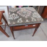 An Edwardian piano stool with hinged seat