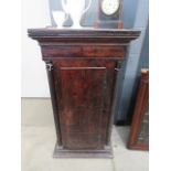 Dark wood single door plinth cupboard with barley twist supports