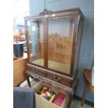 Dark wood glazed china cabinet with drawers on cabriole supports