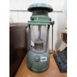 A green painted paraffin lamp