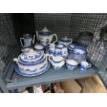 Cage containing blue and white crockery