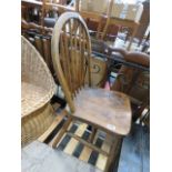 An elm seated stick back dining chair