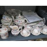 Cage containing a quantity of Spode Chinese rose patterned crockery
