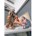 A plaster figure of Jesus, Joseph and Mary, plus an oleograph of Madonna & Child