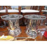 A pair of silver plated paraffin stoves