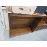 An oak open fronted bookcase