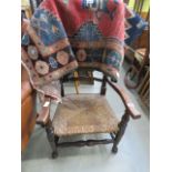 Dark wood ladderback chair with rush seating