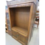 Dark oak open fronted bookcase with cupboard under