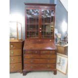 Dark wood bookcase over bureau