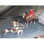Cage containing a huntsman on horse and 5 hounds
