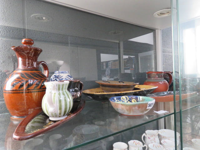 Shelf of assorted stone glazed pottery