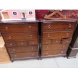 Pair of stag chests of drawers and a headboard, dressing table and open fronted bookcase