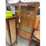 Reproduction walnut china cabinet on cabriole supports