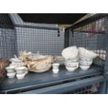 A cage containing a quantity of Spode Chinese Rose pattern crockery