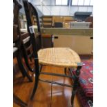 An aesthetic movement bedroom chair with wicker seat