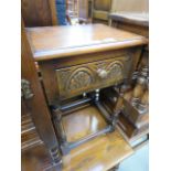 An oak single drawer bedside cabinet