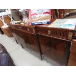 A reproduction mahogany break front sideboard