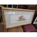 A framed and glazed print with puppies