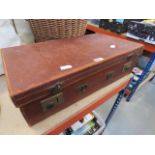Vintage leather suitcase with a quantity of linen
