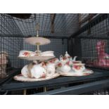 Cage containing a quantity of Royal Albert Old Country Rose patterned crockery
